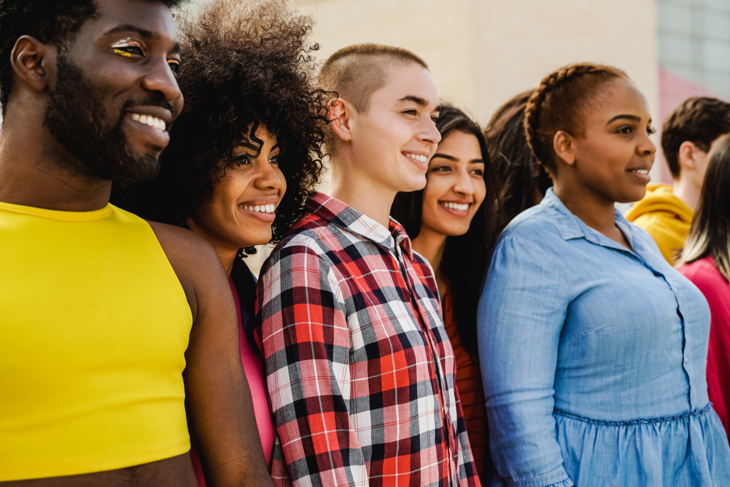 Multiethnic diverse group of people having fun outdoor - Focus on African girl face - Diversity and youth concept