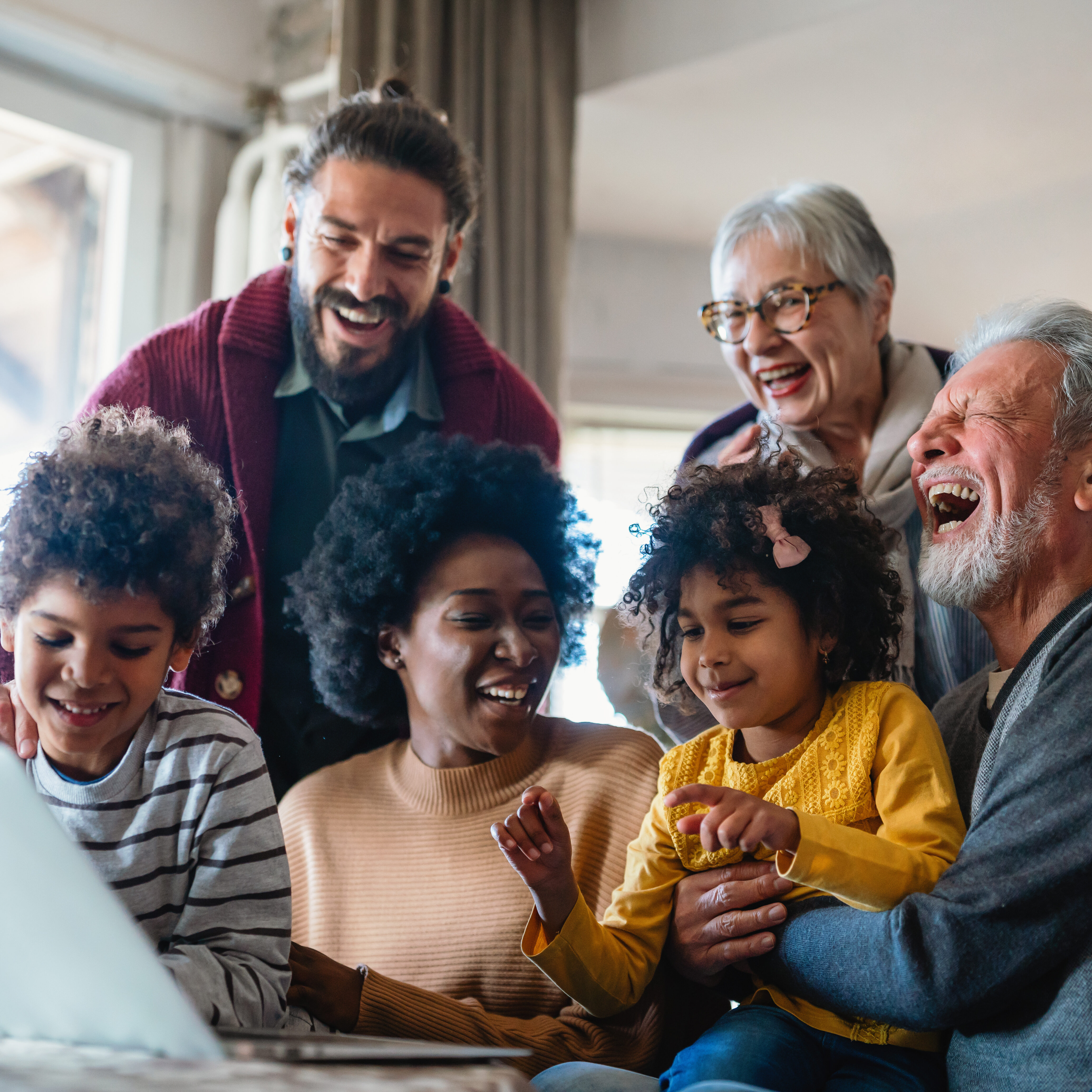 Portrait of a happy multigenerational multiethnic family at home. Portrait of a happy multigenerational multiethnic family at home. People group technology love concept